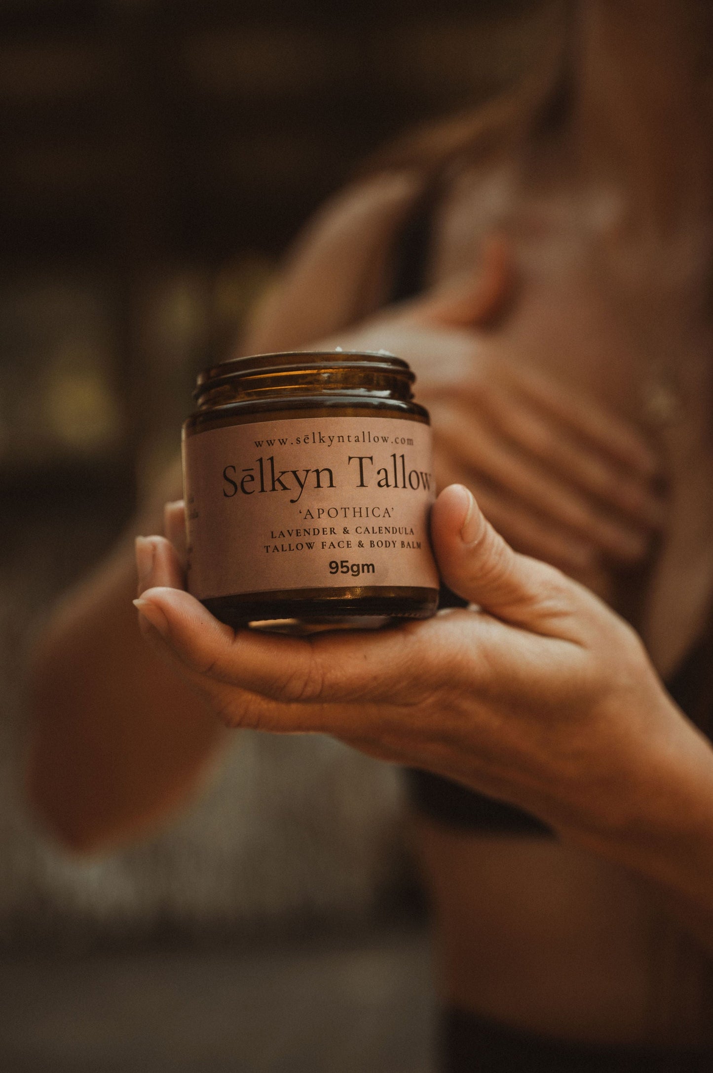 Sēlkyn Tallow balm held in hands, showcasing natural, organic tallow skincare in a soft ritual setting