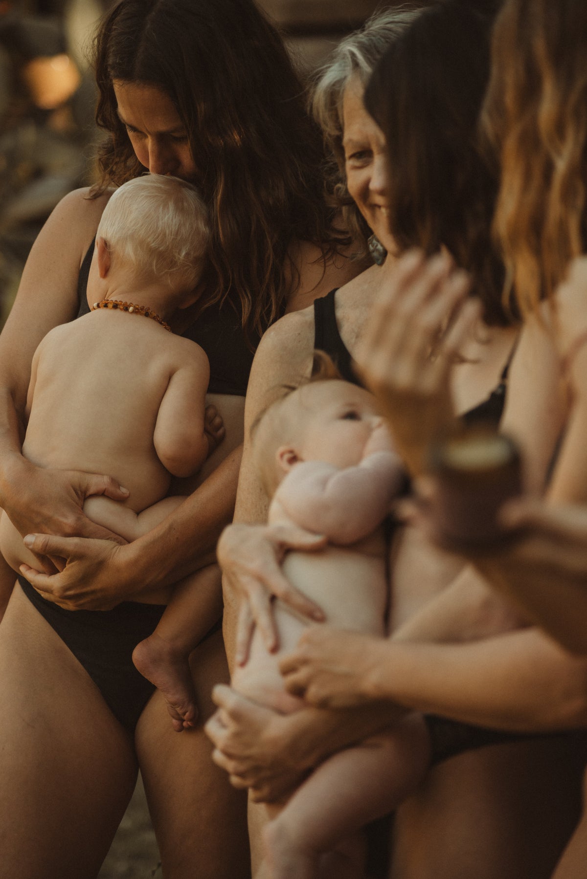 Mothers holding their newborn babies skin-to-skin, a tender postpartum moment reflecting Sēlkyn Tallow's midwifery roots